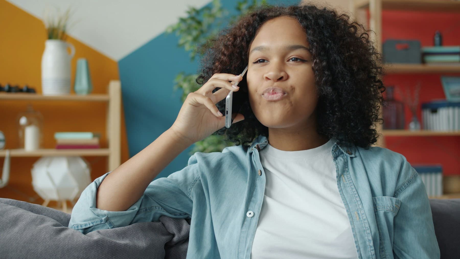 A woman checking in on her family home by phone